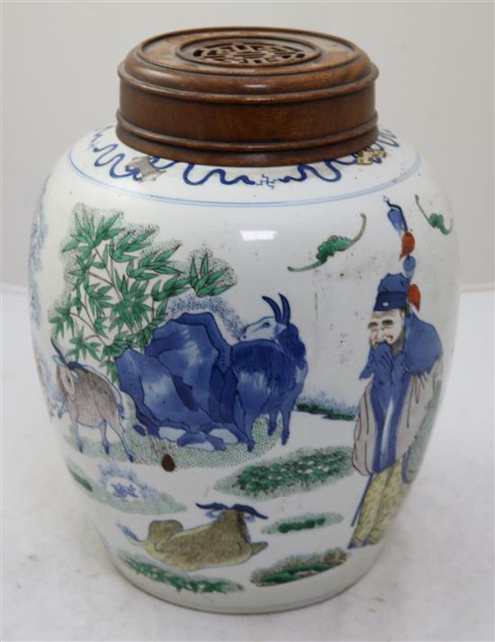 A large Chinese wucai ovoid jar, 19th century, height 27.5cm, rosewood cover and stand, crack to base